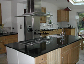 Large granite island and Absolute Black granite worktops in East Sussex.