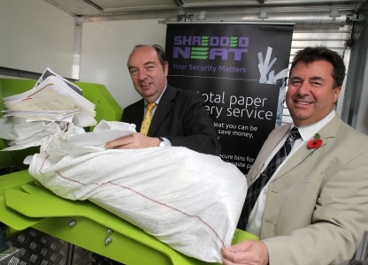Norman Baker MP getting his confidential paper shredded with Shredded Neat MD, Tony Hannigan.