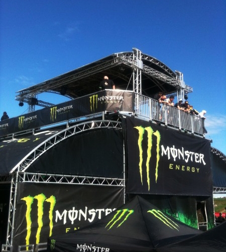 The corporate Monster Energy Drink stand secured by Security Nation.