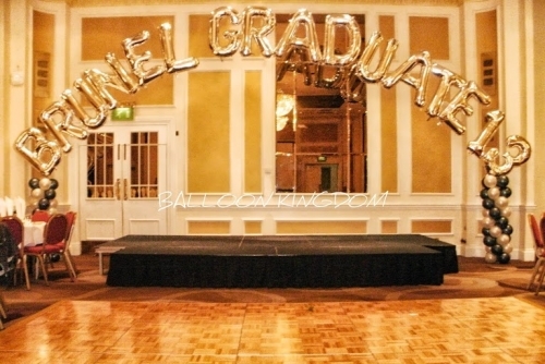 Foil letter balloon arch with spiral columns