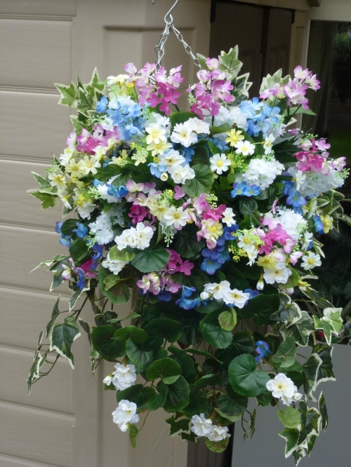 Hanging basket with artificial white geranium