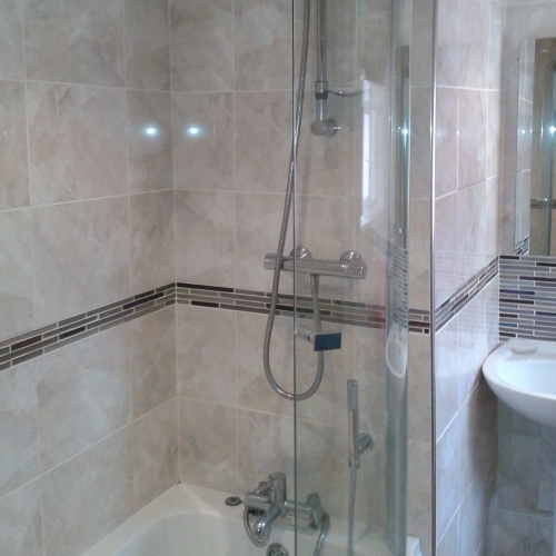 Full Bathroom Installation Showing P Shaped Whirlpool bath, Shower & Screen