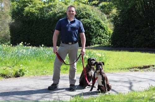 Master Dog Behaviourist  Founder Phillip Gazzard with his own two Boxer dogs